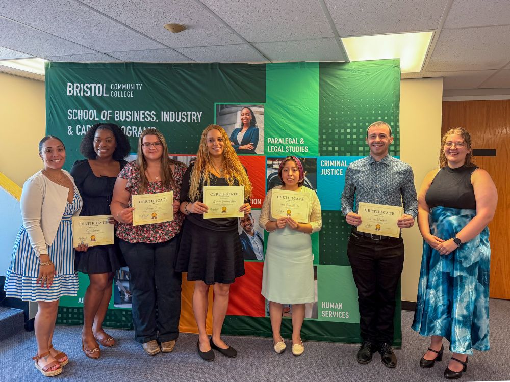 Roadmap to Entrepreneurship program participants standing with certificates of completion
