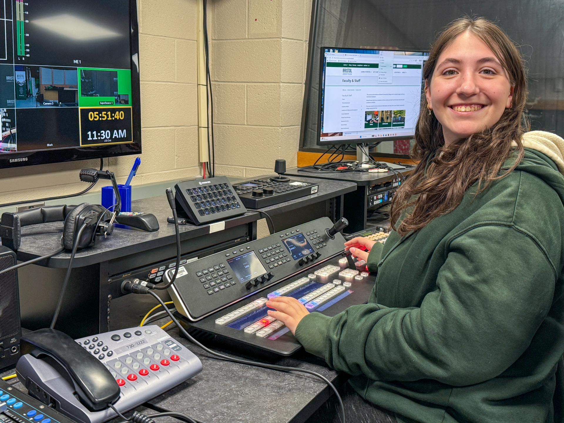 Bristol student and intern working a control board at Fall River Community Television