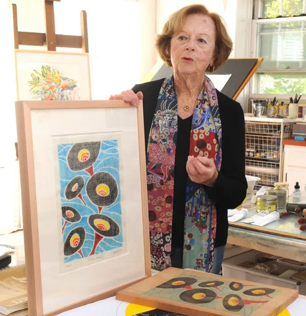 Marion Wilner, Bristol Community College's first art professor, holding one of her works