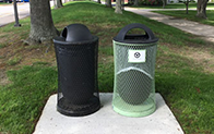 black trash bin and green recycling bin